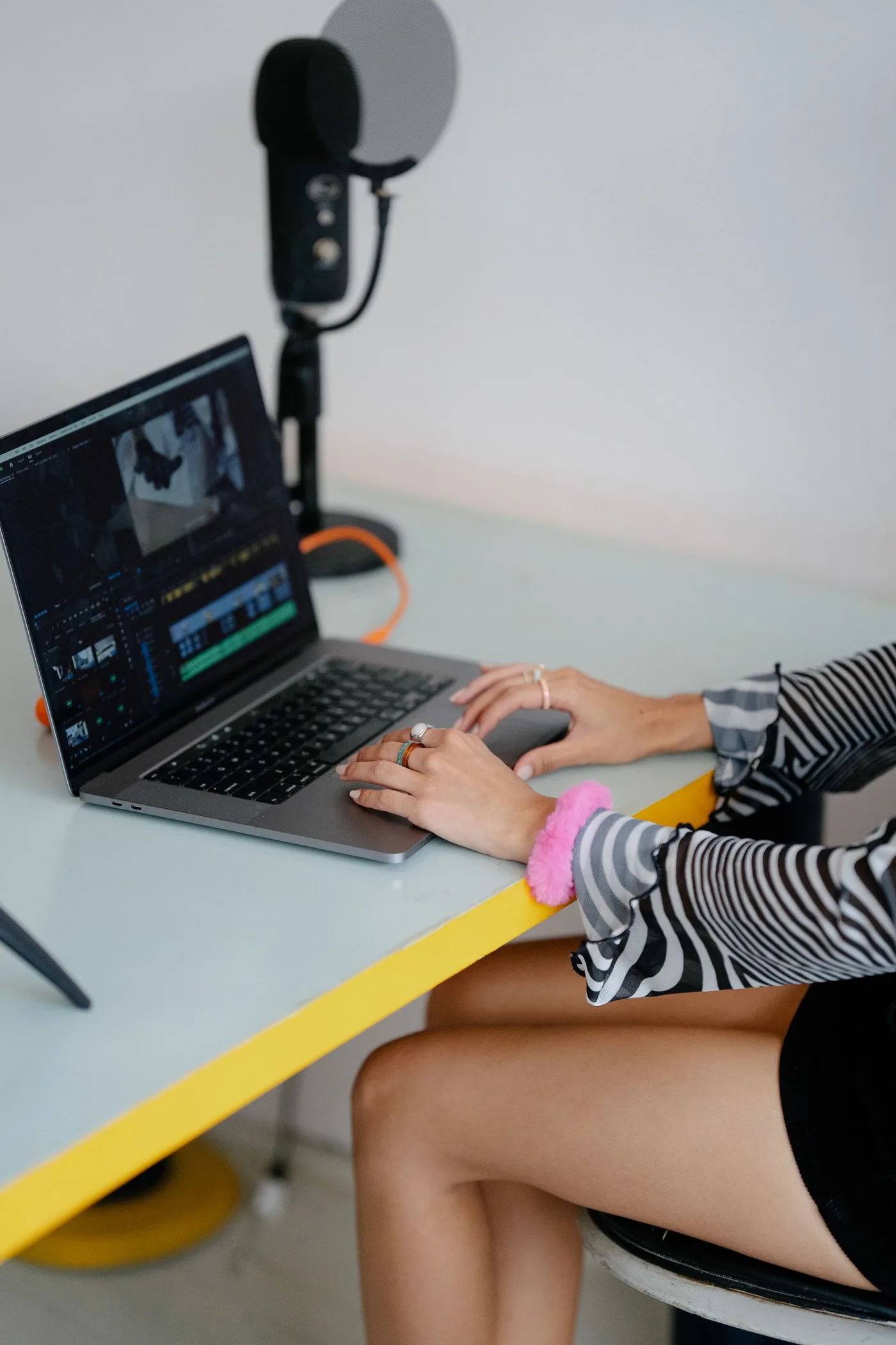 Creative professional editing video at a desk